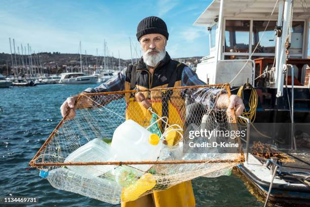 umweltverschmutzung - portrait fisherman stock-fotos und bilder