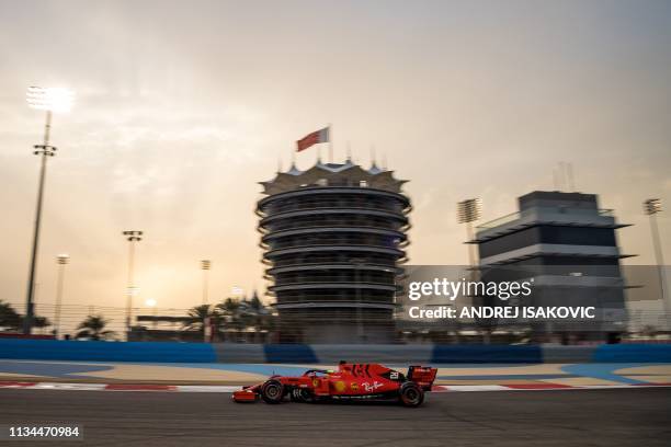 Mick Schumacher steers a Ferrari F1 car during private tests at the Sakhir circuit in the desert south of the Bahraini capital Manama, on April 2,...