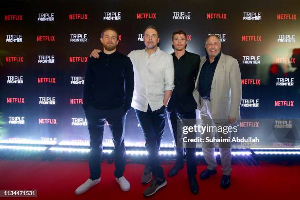 Charlie Hunnam, Ben Affleck, Garret Hedlund and Chuck Roven attend the fan event for the Singapore premiere of 'Triple Frontier' at The Shoppes in...