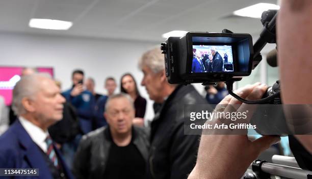 Cameraman films David Gold,David Sullivan and Manuel Pellegrini of West Ham United in the New Training Facility at Chadwell Heath on April 2, 2019 in...