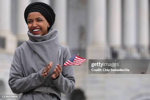 Rep. Ilhan Omar rallies with fellow Democrats before voting on H.R. 1, or the People Act, on the East Steps of the U.S. Capitol March 08, 2019 in...