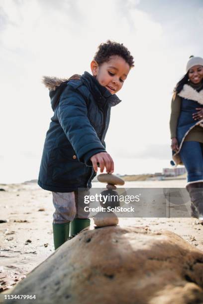 Kids Piling Up Rocks 3,790 Children Playing On Rocks At Beach Stock Photos, High-Res ...