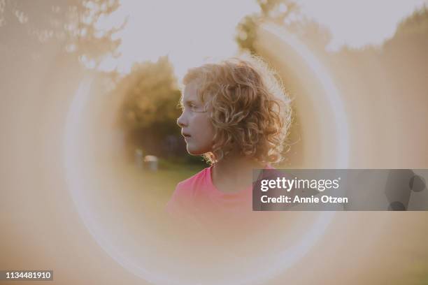 girl with a halo of light - halo stock pictures, royalty-free photos & images