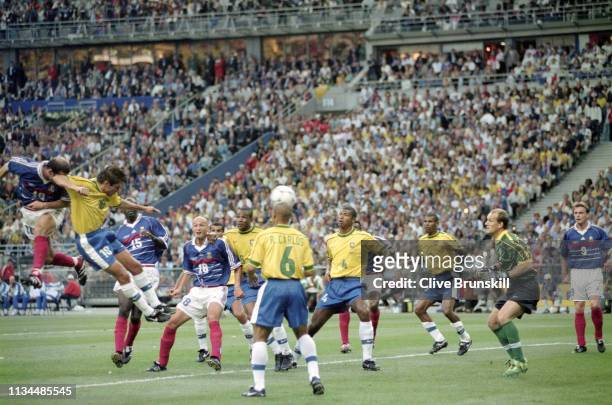 France player ‎Zinedine Zidane scores the first France goal during the 1998 FIFA World Cup Final between France and Brazil at the Stade de France in...