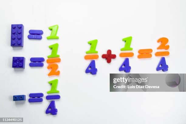 multi colored plastic blocks to teach simple fractions - fractions bildbanksfoton och bilder