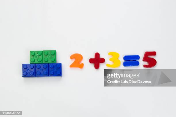 multi color plastic blocks and magnetic of plastic to teach mathematical addition - number magnet stock pictures, royalty-free photos & images