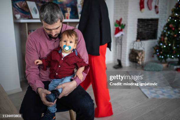 father taking care of toddler boy - pacifier stock pictures, royalty-free photos & images