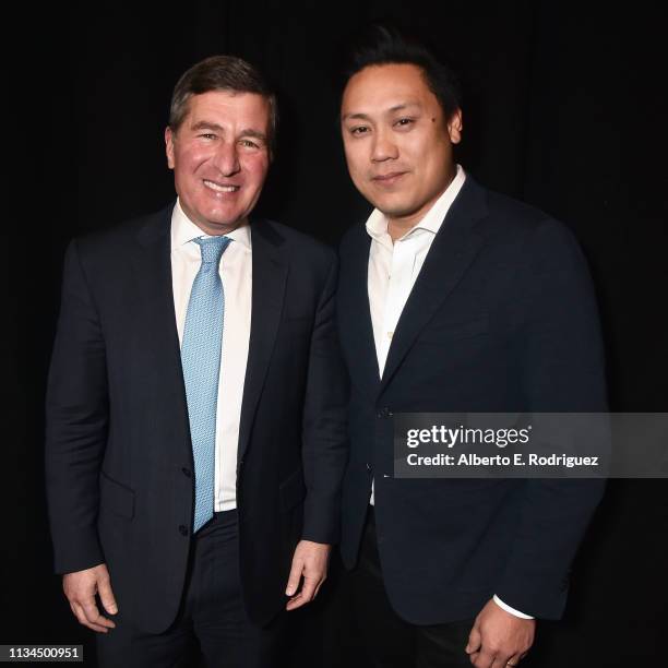 Chairman & CEO Charles Rivkin and Jon M. Chu pose backstage at CinemaCon 2019 The State of the Industry and STXfilms Presentation at The Colosseum at...