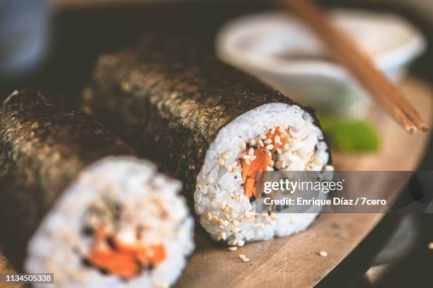 making sushi at home, hand rolls close up - hand roll stock pictures, royalty-free photos & images