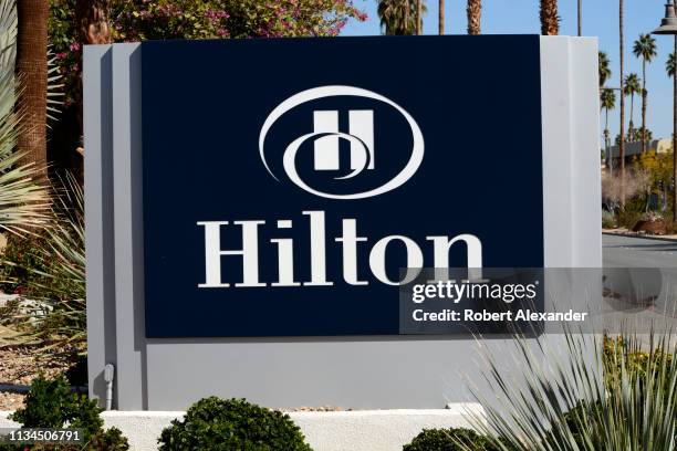 Business sign in front of a Hilton Hotel in Palm Springs, California.