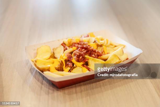 fries with cheese and beacon - fast food french fries stock pictures, royalty-free photos & images