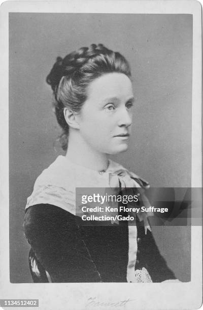 Cabinet photo with a close-up, three-quarter profile portrait of English suffragist and writer Millicent Fawcett, seated in a chair, photographed by...