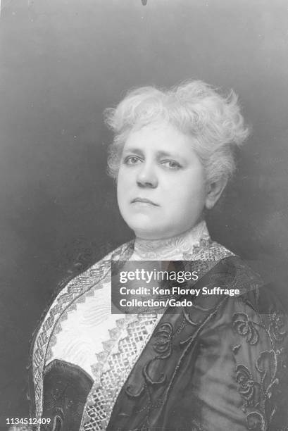 Cabinet photo with a close-up, partial profile portrait of American suffragist Mary Garrett Hay, with her head turned toward the camera and a serious...