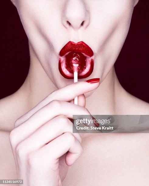 woman sucking lollipop - lollipops stock pictures, royalty-free photos & images
