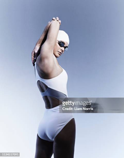swimmer stretching - swimming cap stock pictures, royalty-free photos & images