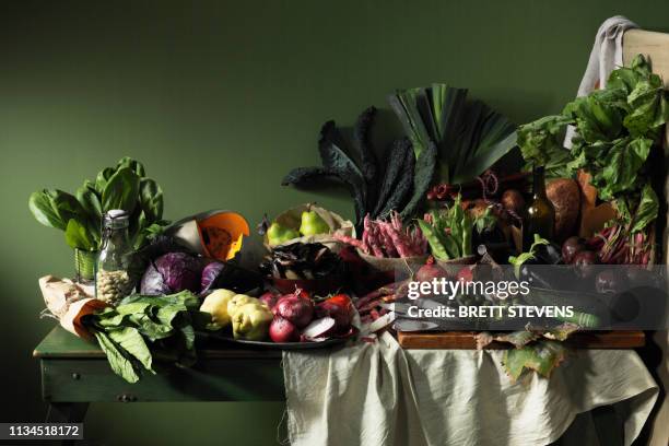 fruits and vegetables on table - naturaleza muerta fotografías e imágenes de stock