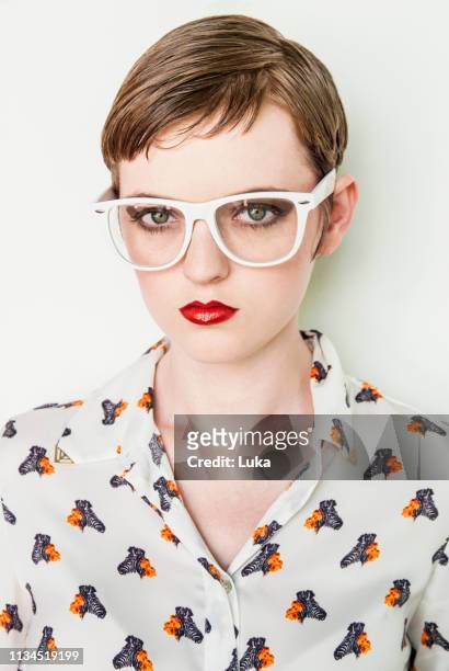 girl wearing patterned blouse - patterned blouse stock pictures, royalty-free photos & images