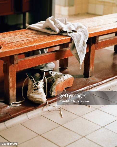 old training shoes in locker room - towel imagens e fotografias de stock