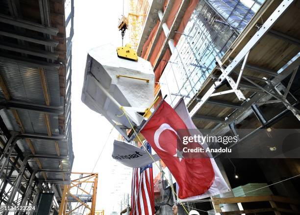 Turkish flag is seen during a ceremony of the last concrete bucket to be carried to the top 35th floor in still continuing construction of Turkish...