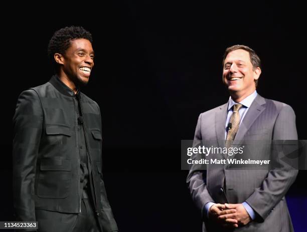 Chadwick Boseman and STXFilms Motion Picture Group Chairman Adam Fogelson speak onstage at CinemaCon 2019 The State of the Industry and STXfilms...