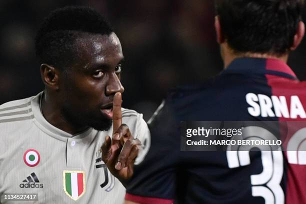 Juventus' French midfielder Blaise Matuidi gestures as he talks to Cagliari's Croatian defender Darijo Srna during the Italian Serie A football march...