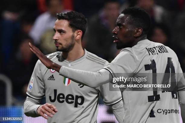 Juventus' French midfielder Blaise Matuidi gestures towards towards Cagliari's fans who threw projectiles and bottles after Juventus' Italian forward...