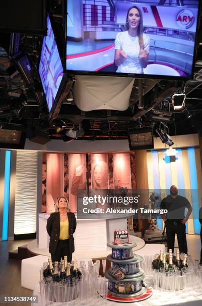 Dra Ana Maria Polo is seen viewing a video message from Jessica Carrillo on the set of "Caso Cerrado" during the 18th anniversary celebration of her...