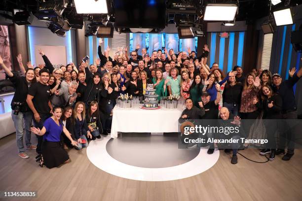 David Chocarro and Dra Ana Maria Polo pose with executives and crew members on the set of "Caso Cerrado" during the 18th anniversary celebration of...