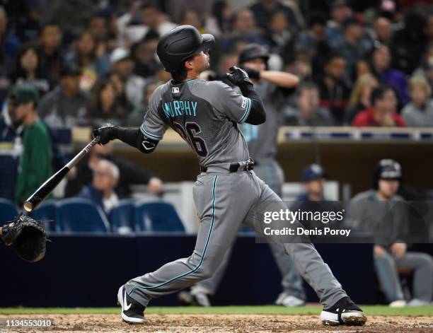 John Ryan Murphy of the Arizona Diamondbacks hits a solo home run during the sixth inning of a baseball game against the San Diego Padres at Petco...