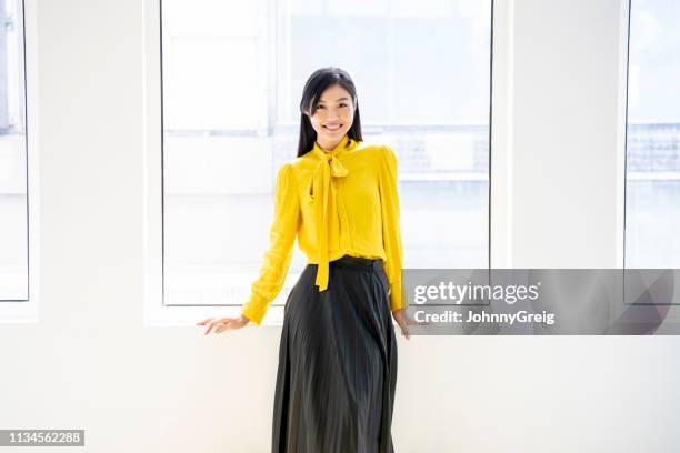 ritratto di donna asiatica sulla 30 anni in abito intelligente - yellow blouse foto e immagini stock