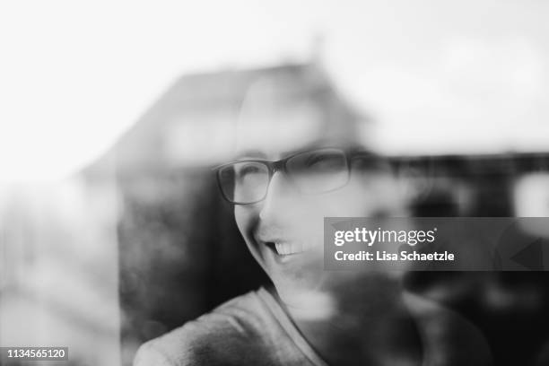 man looking out of a window daydreaming - black and white office stock pictures, royalty-free photos & images