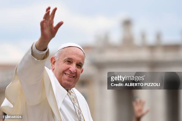 Pope Francis waves to worshipers at the end of the weekly general audience on April 3, 2019 at St. Peter's square in the Vatican.