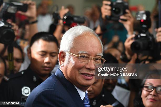 Malaysia's former prime minister Najib Razak leaves a court in Kuala Lumpur on April 3 after facing his trial over alleged involvement in the looting...