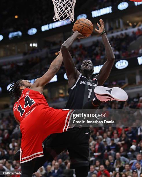 Thon Maker of the Detroit Pistons is fouled by Wayne Selden of the Chicago Bulls at the United Center on March 08, 2019 in Chicago, Illinois. NOTE TO...