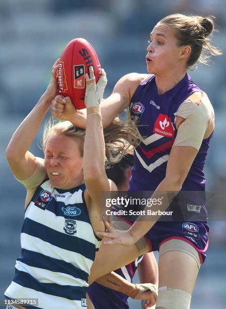 Phoebe McWilliams of the Cats and Ebony Antonio of the Dockers compete for the ball during the round six AFL match between the Geelong Cats and the...