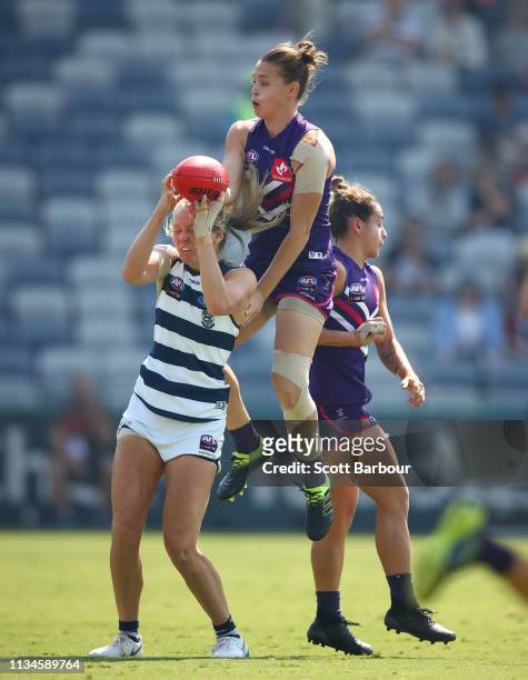 Phoebe McWilliams of the Cats and Ebony Antonio of the Dockers compete for the ball during the round six AFL match between the Geelong Cats and the...