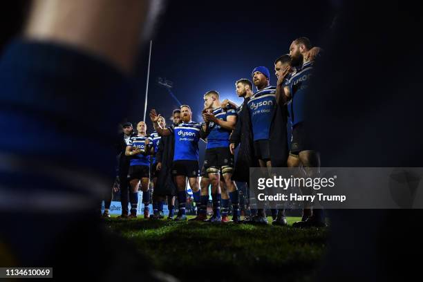 The Bath Rugby side hold a post match huddle during the Gallagher Premiership Rugby match between Bath Rugby and Saracens at Recreation Ground on...