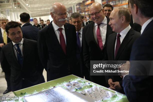 Russian President Vladimir Putin talks with Dieter Zetsche , Chairman of the Management Board of Mercedes-Benz as he attends the opening ceremony of...