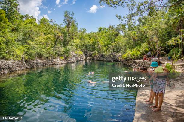 Cueva de Los Peces, a saltwater lake in the Caribbean jungle, actually it is a 70m deep with crystal clear pool water, flooded cenote, tectonic fault...