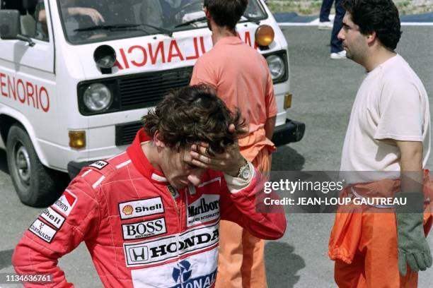 Brazilian driver Ayrton Senna reacts after having seen British driver Martin Donnelly's crash during the time trials of the F1 Grand Prix of Spain on...