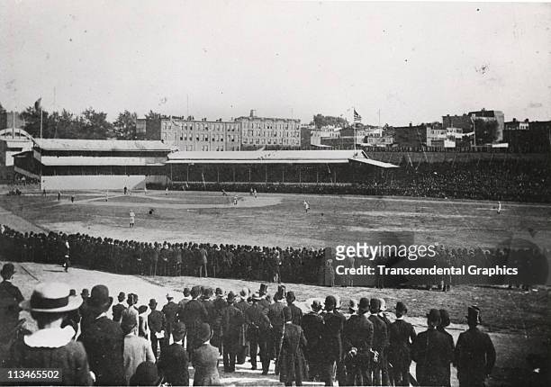 On Decoration Day, a photographer records a game in progress at Washington Park in Brooklyn between the Trolley Dodgers and the St. Louis Browns on...