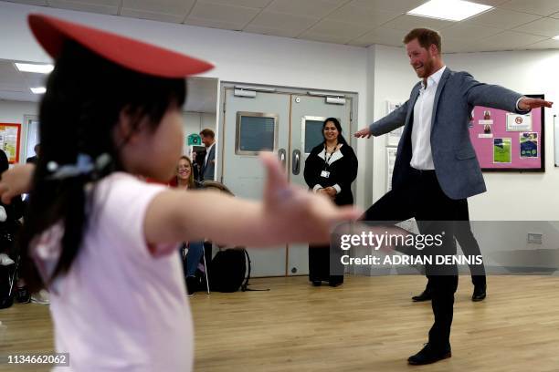 Britain's Prince Harry, Duke of Sussex takes part in a ballet class for 4 to 6 year olds, while on a visit to YMCA South Ealing in west London on...