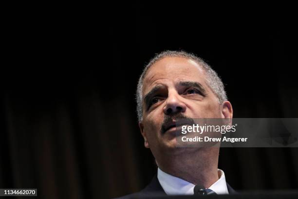 Former U.S. Attorney General Eric Holder speaks at the National Action Network's annual convention, April 3, 2019 in New York City. A dozen 2020...