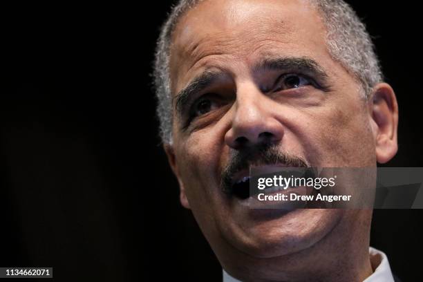 Former U.S. Attorney General Eric Holder speaks at the National Action Network's annual convention, April 3, 2019 in New York City. A dozen 2020...