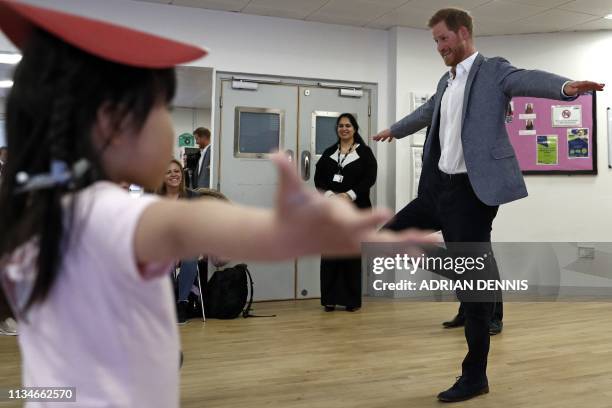 Britain's Prince Harry, Duke of Sussex joins children taking part in ballet class for 4 to 6 year olds, while on a visit to YMCA South Ealing in west...
