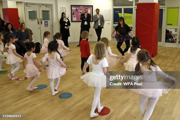 Prince Harry, Duke of Sussex observes children taking part in ballet class for 4 to 6 year olds, during a visit to YMCA South Ealing, to learn more...