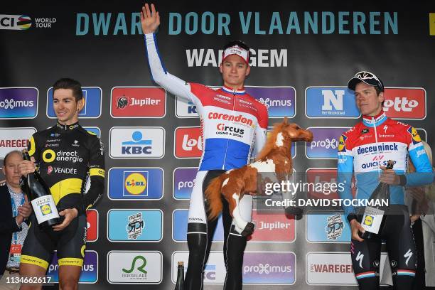 Netherlands' Matthieu Van der Poel of Corendon-Circus celebrates his victory flanked by second-placed France's Anthony Turgis of Direct Energie and...
