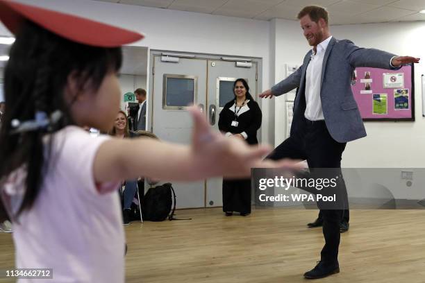Prince Harry, Duke of Sussex joins children taking part in ballet class for 4 to 6 year olds, during a visit to YMCA South Ealing, to learn more...