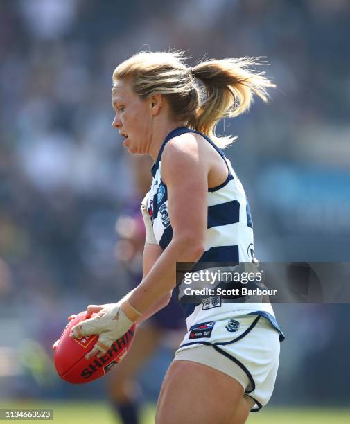 Phoebe McWilliams of the Cats runs with the ball during the round six AFL match between the Geelong Cats and the Fremantle Dockers at GMHBA Stadium...