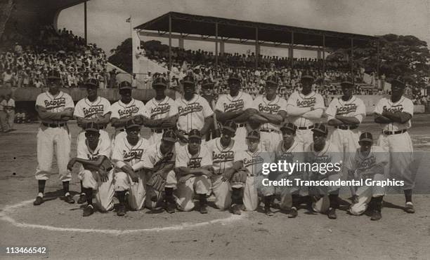 The Escogido Baseball Club poses for their team shot circa 1937 in Santo Domingo, Dominican Republic. Martin Dihigo, their star pitcher, stands in...